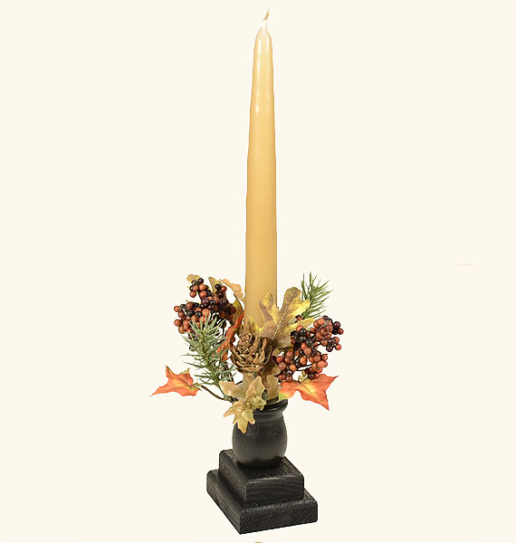 Ways to make a conical candle stand upright in a holder