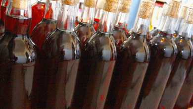 Man Sweetening A Wine Before Bottling