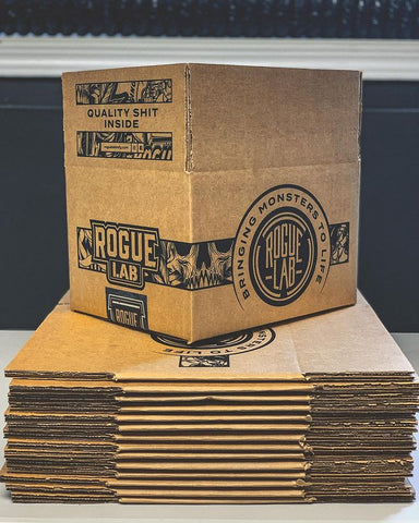 Flat and stacked custom cardboard boxes with one folded on top