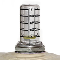 A hot oil float gauge has a disc inside that indicates how full the tank is. This should only be used as an approximation of tank fullness.