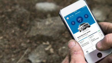 Man operating Ford SYNC Connect app from iPhone