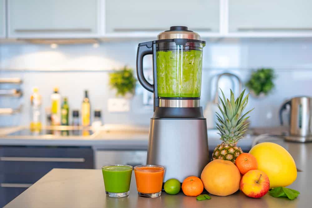 Making green smoothies with blender