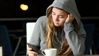 woman reading texts from ex-boyfriend