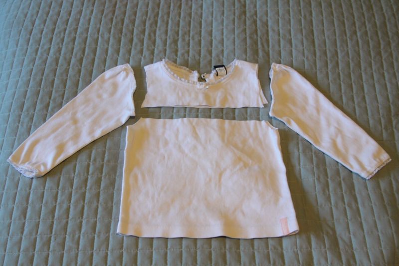 long-sleeve white shirt with sleeves cut off and shirt cut across the chest