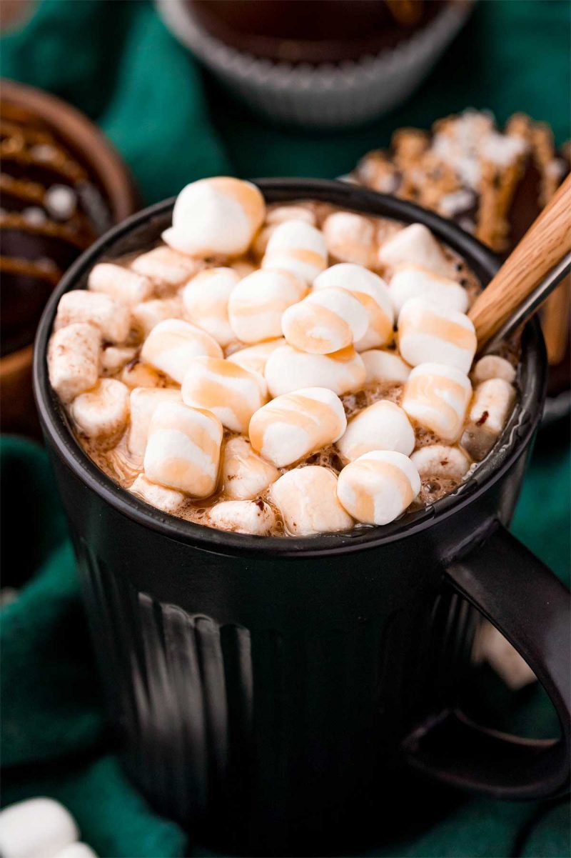 Caramel hot chocolate and topped with marshmallows and caramel drizzle.