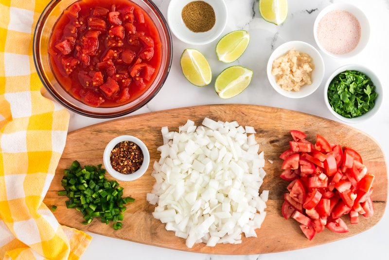 salsa ingredients placed on cutting board