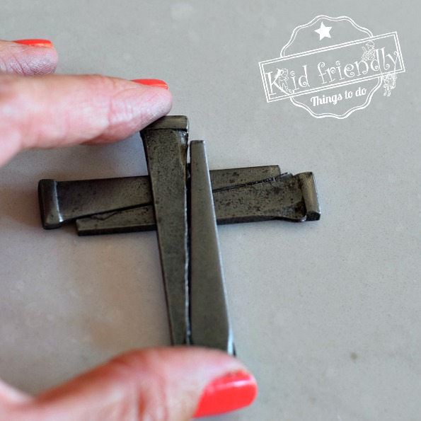 Make a cross necklace from nails