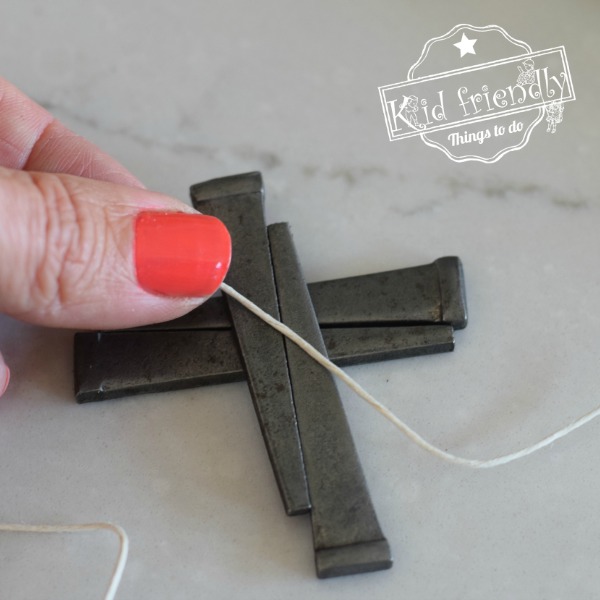 Make a cross necklace from nails