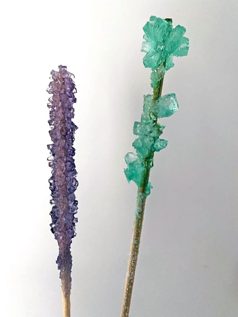 Purple and green rock candy made from reused sugar solution without re-heating and adding more sugar
