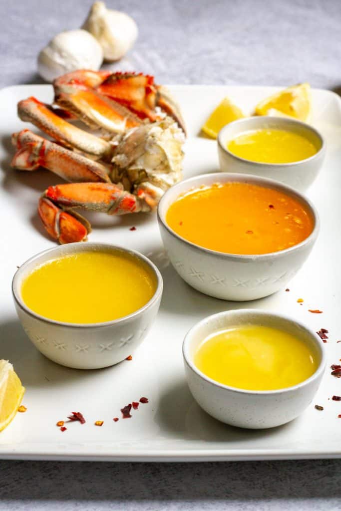 crab butter sauce on a plate with crab legs