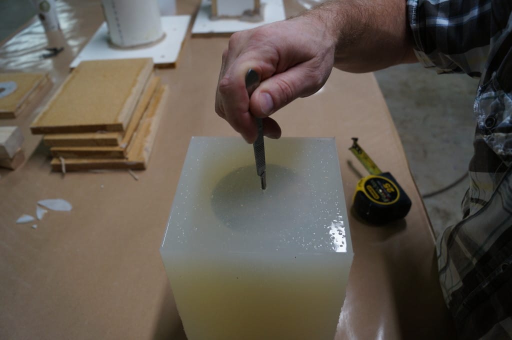 Make a hole in the rubber mold for the Wick