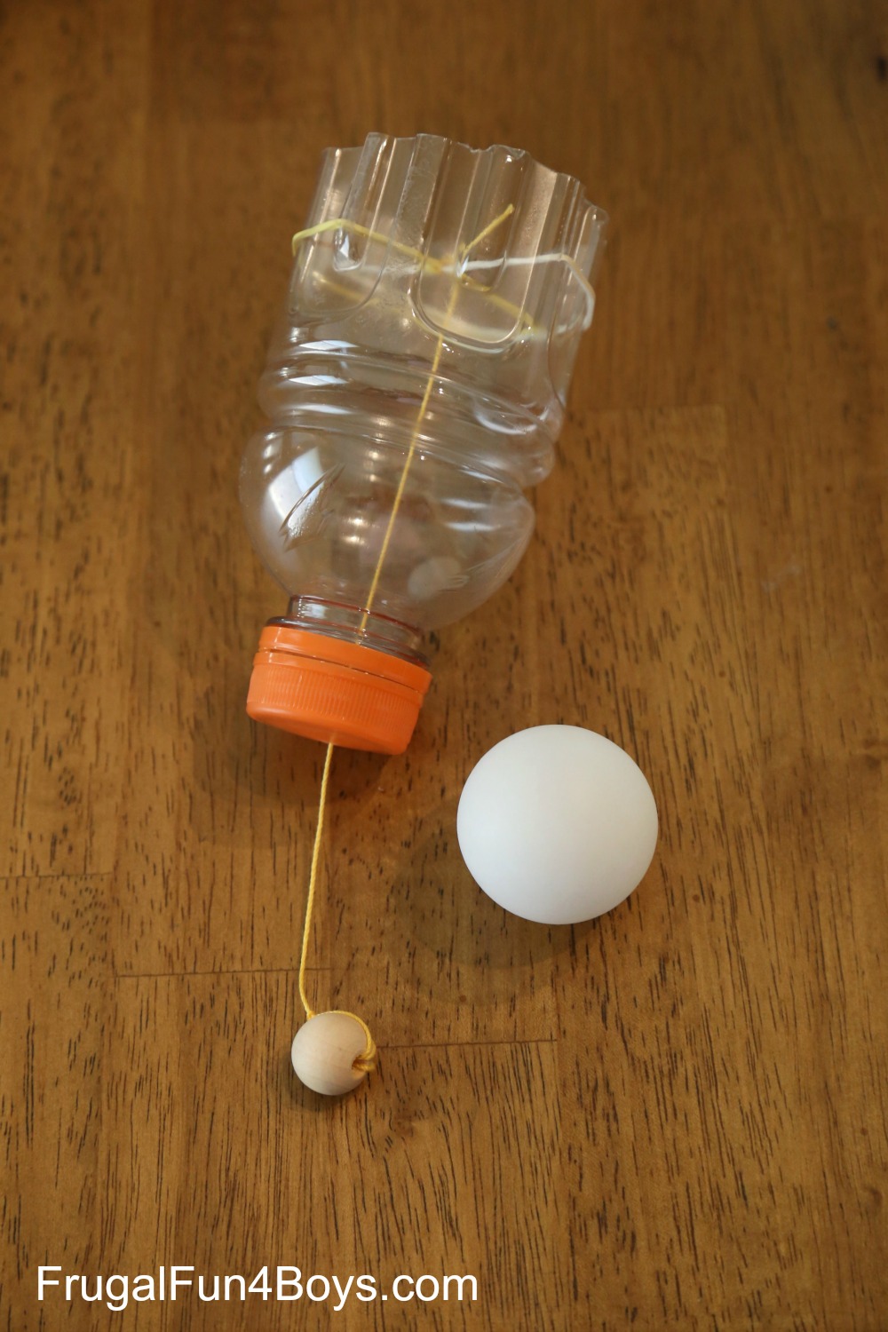 Play the Ping Pong Ball! Make a homemade shotgun from a plastic bottle.