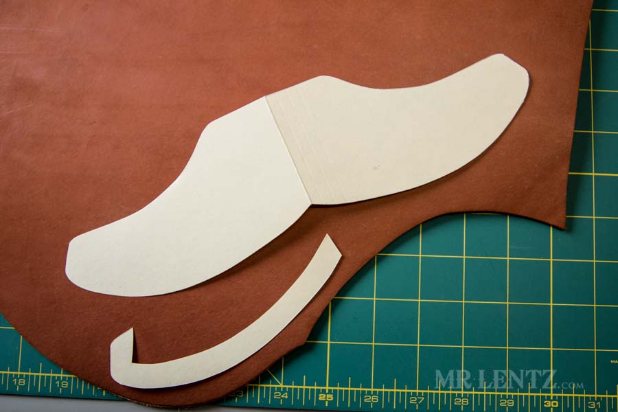 tracing axe sheath template onto leather