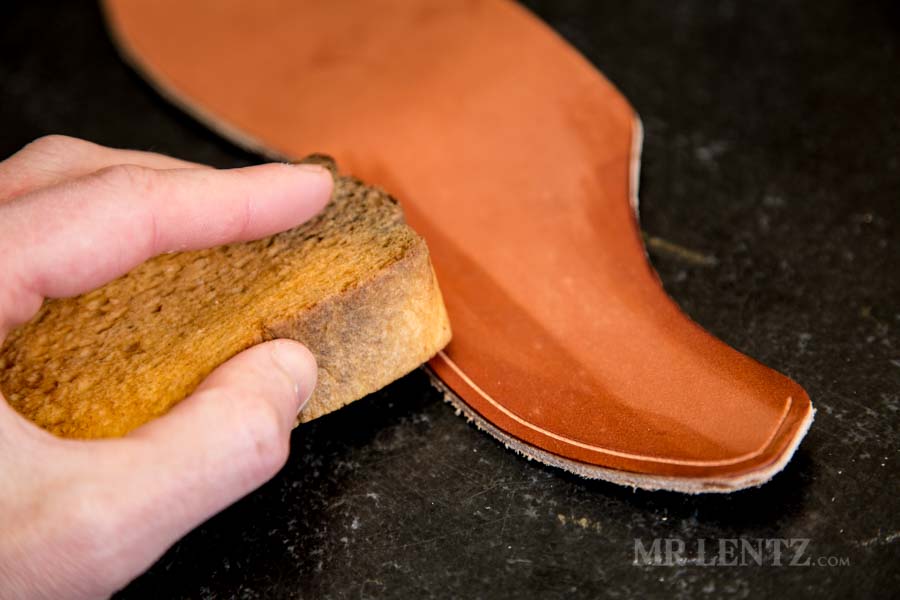 wetting the leather edge on an axe sheath