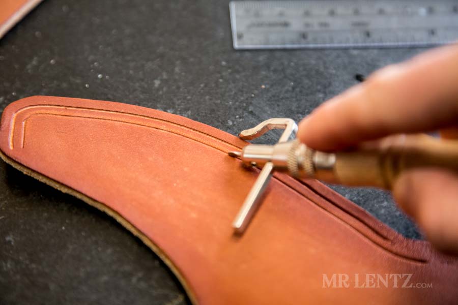 marking decorative line in sheath for an axe