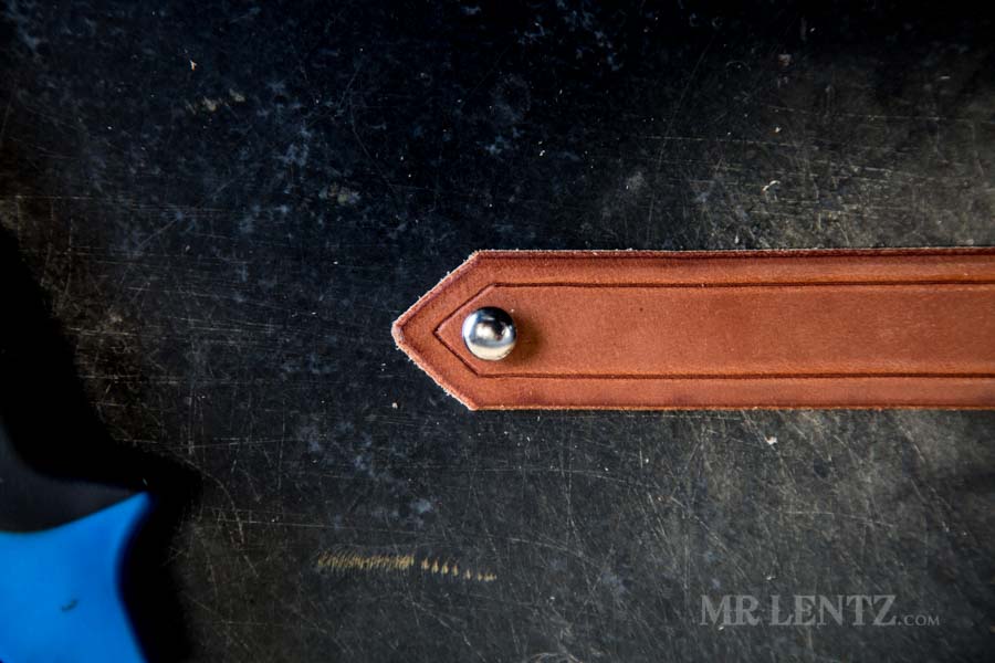 marking the rivet hole on strap for axe sheath