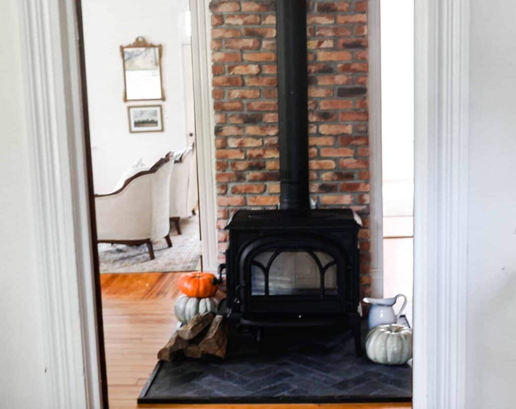 wood stove with brick chimney and do-it-yourself fireplace in black slate