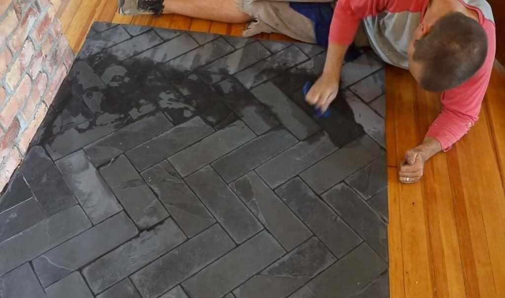 the man who rubs the tile grout