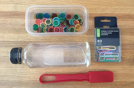 Magnetic chopsticks, plastic bottles and bingo chips in plastic boxes.