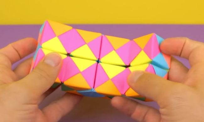 Students play with a colorful paper folding infinity block (DIY)