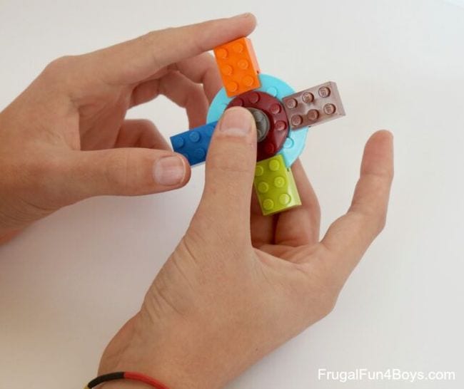 Students play with LEGO fidget spinner toys
