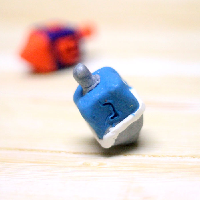 How to make a dreidel from clay a perfect craft for Hanukkah! You can totally do these as a chanukah party activity because they don't