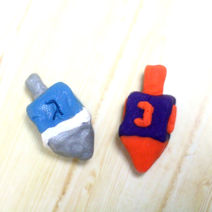 How to make a dreidel from clay a perfect craft for Hanukkah! You can totally do these as a chanukah party activity because they don't