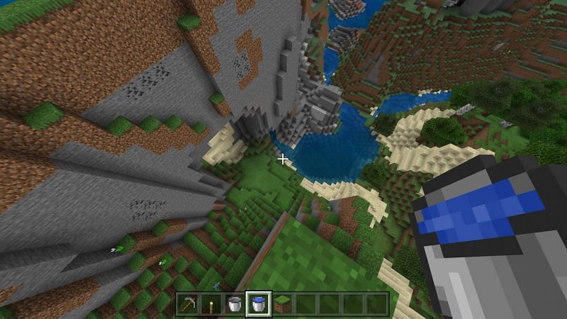 use buckets of water to create waterfalls for safe travel in Minecraft