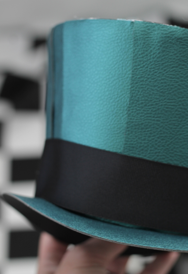 Closeup mad hatter hat_peacock pebbled leather