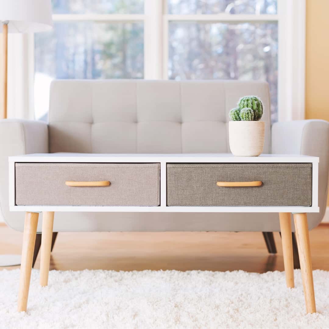 Mid-century modern coffee table with corner legs screwed into place by hanging pegs