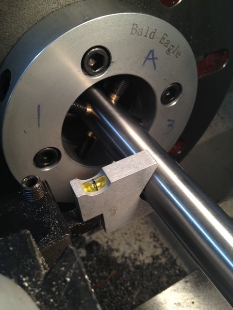 The machine setting gauge is used to adjust the high speed steel cutter to the centerline of the barrel.