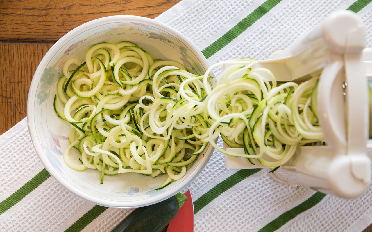 how to grate zucchini Spiral zucchini noodles called zoodles are prepared in the kitchen appliance spiralizer