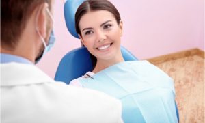 Woman going to her dentist to have her teeth contoured.