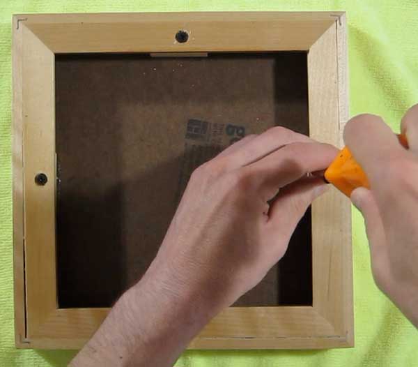 attach panel to frame with screws