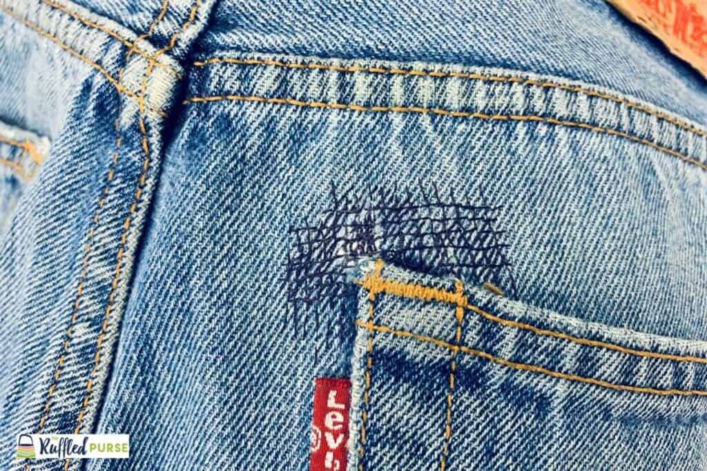 The finishing fix on a corner of a pair of jeans