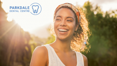 woman smiling without white spots or yellow stains on teeth after braces