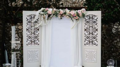 Knowing how to make a floral arch swag for your wedding arch can save you a ton of money. Follow our step-by-step directions for a stunning swag!