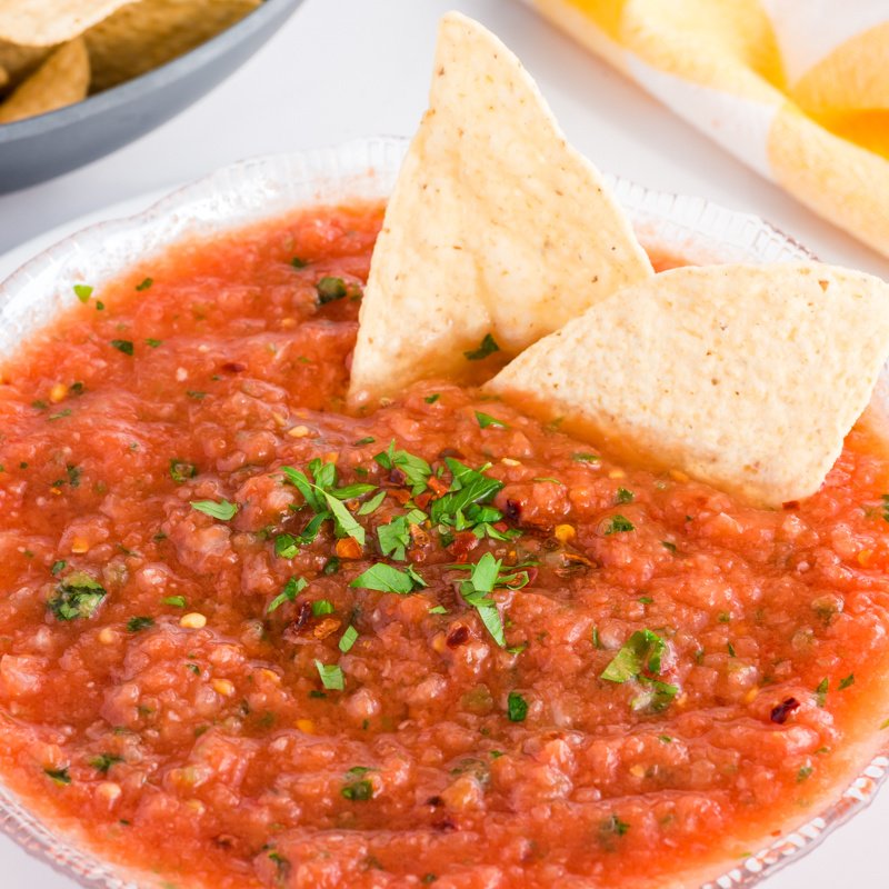 Close-up of homemade salsa with stuck fries