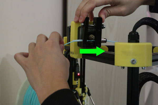 Manually insert the filament into the preheated hot end