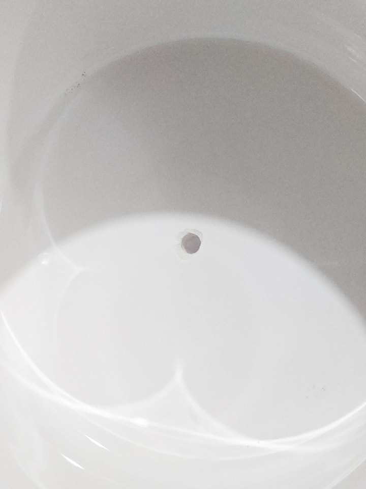 Hole in ceramic pot