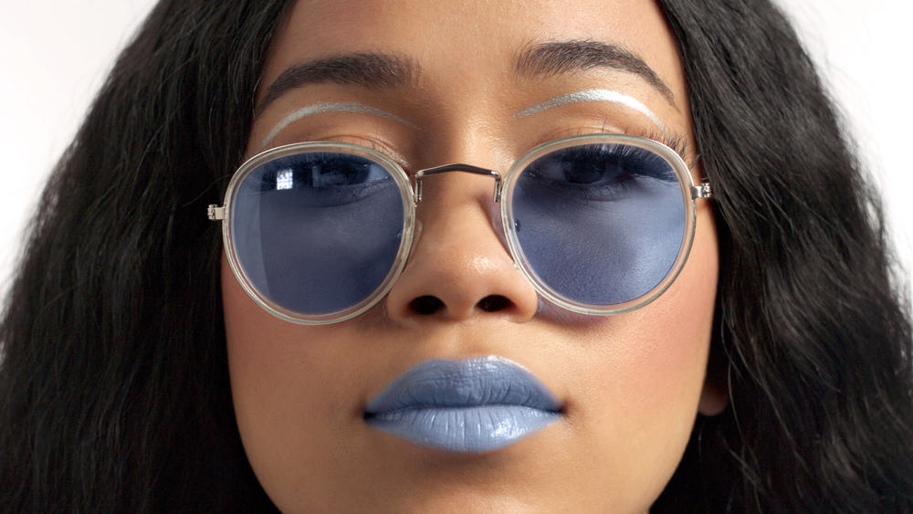 Light skinned woman with blue lipstick