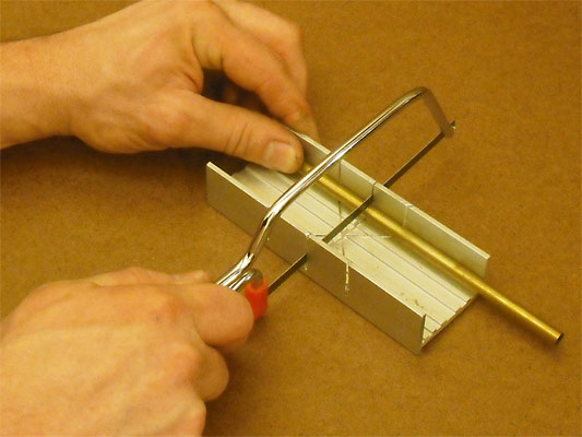 Cut the brass sheet sandwiched between two thin sheets of plywood