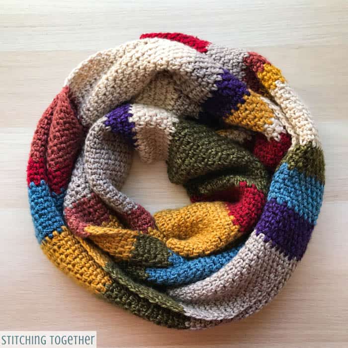 multicolored woolen scarf wrapped on the ground