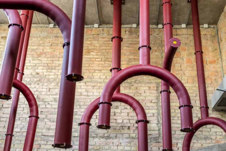 The exposed pipes inside are brightly painted