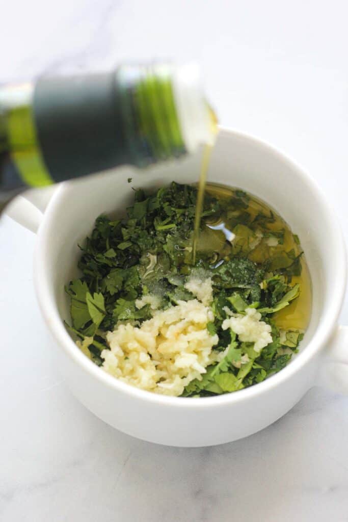 minced garlic, minced cilantro, salt and olive oil in a mixing bowl