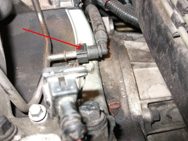 Locate the fuel rail on the fuel injector 1
