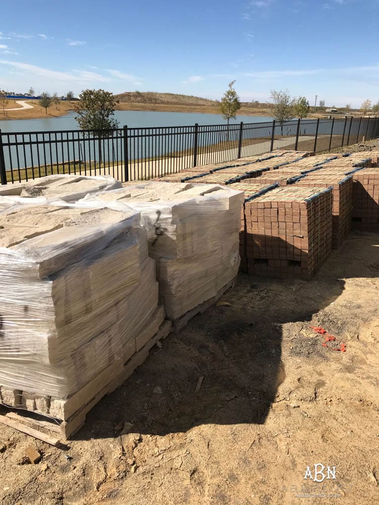 All the brick and stone pallets for the outside of our new house have been moved to our backyard! Excited to get started! Want to know how to choose tiles for your home? Take it one step at a time with this helpful guide.