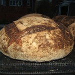 Bake sourdough bread in quantity.