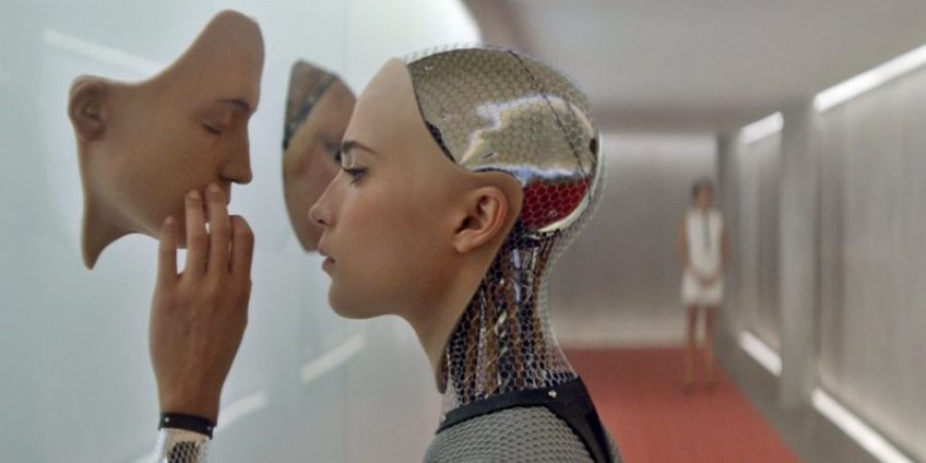 A screenshot from the Ex Machina movie in which an android picks a face for itself