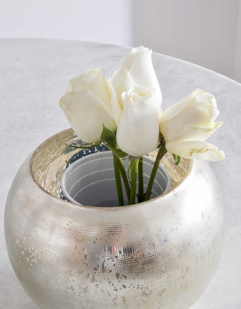 Arrange roses in a round vase